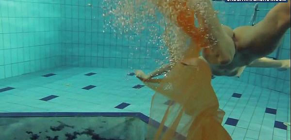  Yellow and Red clothed teen underwater